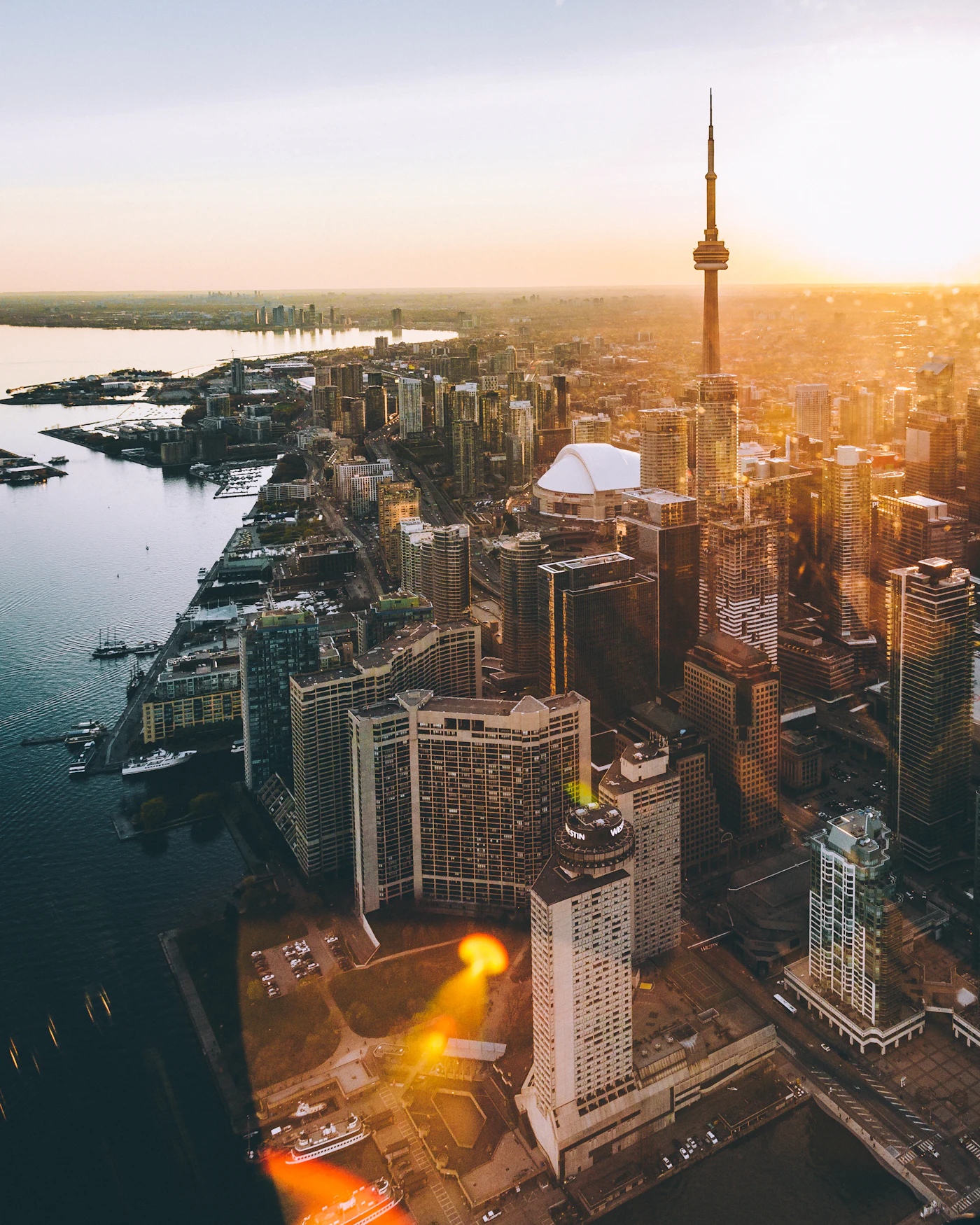 Downtown Toronto and the CN Tower at golden hour, where Hypermaids cleans condos and offices