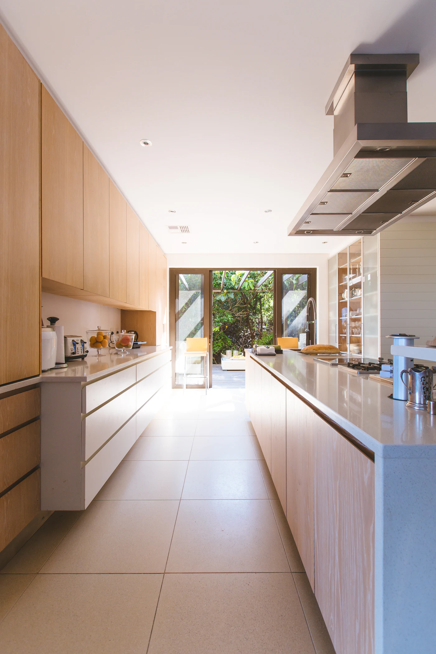 Bright kitchen with spotless cabinet interiors and wiped down counters after a move out cleaning service